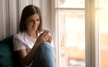 Stock Video Happy Woman Uses Mobile App Sitting In Window Animated Wallpaper