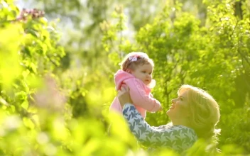 Stock Video Happy Woman Throws Her Daughter In The Air Animated Wallpaper
