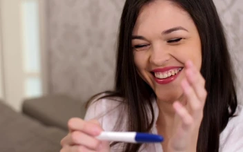 Stock Video Happy Woman Smiles When Checking That She Is Pregnant Animated Wallpaper