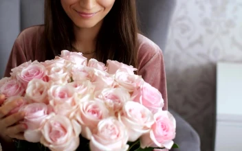 Stock Video Happy Woman Smelling A Bouquet Of Pink Roses Animated Wallpaper