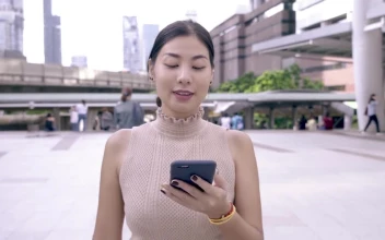 Stock Video Happy Woman Reading Messages On Her Cell Phone Animated Wallpaper