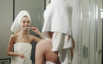 Stock Video Happy Woman Brushing Her Teeth In Her Morning Routine Animated Wallpaper