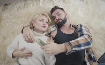 Stock Video Happy Rich Couple Lay On Rug And Count Cash Animated Wallpaper