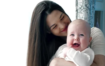 Stock Video Happy Mother Hugging Her Baby Animated Wallpaper