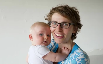 Stock Video Happy Mother Holds And Kisse Baby On White Background Animated Wallpaper