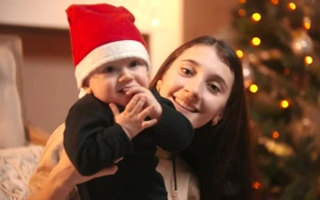 Stock Video Happy Mom Holding Her Baby At Christmas Animated Wallpaper