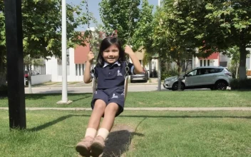 Stock Video Happy Little Girl On A Swing In A Park Animated Wallpaper