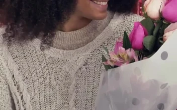 Stock Video Happy Girl Smelling A Bouquet Of Flowers On Valentines Day Animated Wallpaper