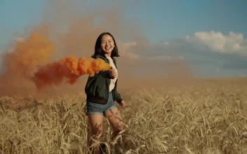 Stock Video Happy Girl Jumping With A Smoke Flare Animated Wallpaper