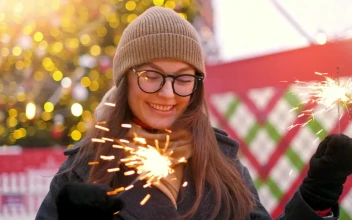 Stock Video Happy Girl Holding Sparkles At Christmas Animated Wallpaper