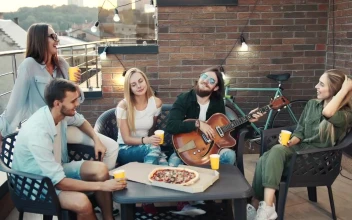 Stock Video Happy Friends Spending Time Together On A Rooftop Animated Wallpaper