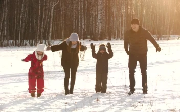 Stock Video Happy Family Jumps In The Snow In A Forest Animated Wallpaper