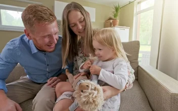 Stock Video Happy Family In An Armchair In Their New House Animated Wallpaper
