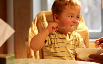 Stock Video Happy Child Eating Breakfast Animated Wallpaper