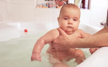 Stock Video Happy Baby Being Bathed In The Tub Animated Wallpaper