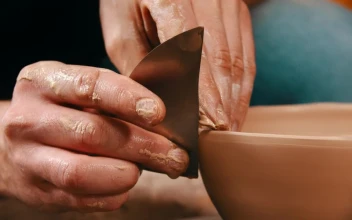 Stock Video Hans Molding A Clay Bowl With A Metal Tool Animated Wallpaper