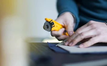 Stock Video Hands Using Tool To Cut Fabric Animated Wallpaper
