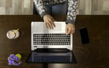 Stock Video Hands Typing On A Laptop Top Shot Animated Wallpaper