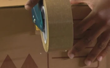 Stock Video Hands Of Two People Sealing A Package With Tape Animated Wallpaper