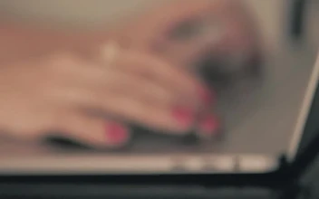Stock Video Hands Of A Woman Typing On A Laptop Animated Wallpaper