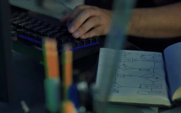 Stock Video Hands Of A Programmer Working On A Desk Animated Wallpaper