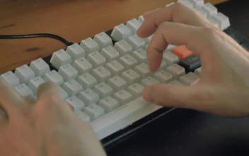 Stock Video Hands Of A Person Typing On An Editing Keyboard Animated Wallpaper