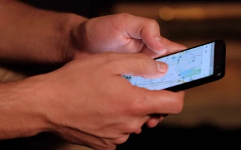 Stock Video Hands Of A Person Searching A Map On His Cell Animated Wallpaper