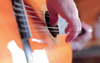 Stock Video Hands Of A Person Playing The Guitar Animated Wallpaper