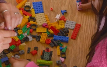 Stock Video Hands Of A Mother And Daughter Playing With Legos Animated Wallpaper