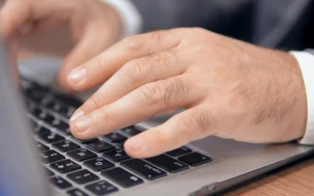 Stock Video Hands Of A Man Typing On A Laptop Animated Wallpaper