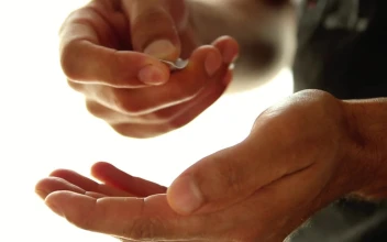 Stock Video Hands Of A Man Taking Pills From A Packaging Animated Wallpaper