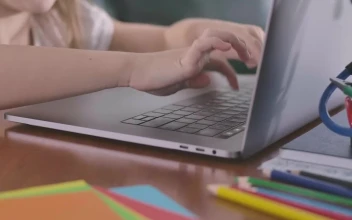 Stock Video Hands Of A Girl Typing A Laptop Animated Wallpaper