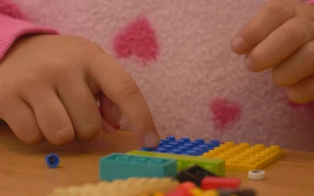 Stock Video Hands Of A Girl Playing With Lego Pieces Animated Wallpaper