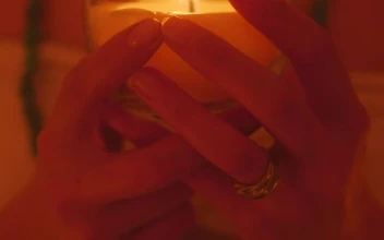 Stock Video Hands Of A Girl Holding A Candle In The Dark Animated Wallpaper