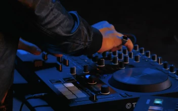 Stock Video Hands Of A Dj Turning Knobs On His Equipment Animated Wallpaper