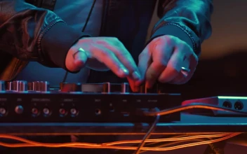 Stock Video Hands Of A Dj Turning Knobs On A Turntable Animated Wallpaper