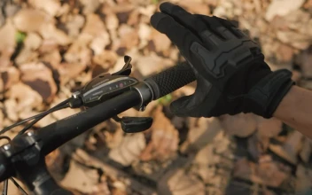 Stock Video Hands Of A Cyclist Taking The Handlebars Of His Bicycle Animated Wallpaper