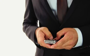 Stock Video Hands Of A Businessman Texting On A Cell Phone Animated Wallpaper