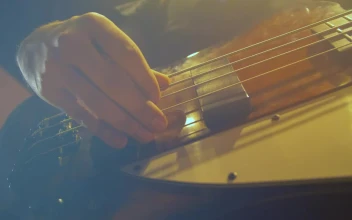 Stock Video Hands Of A Bass Player Playing A Song Animated Wallpaper