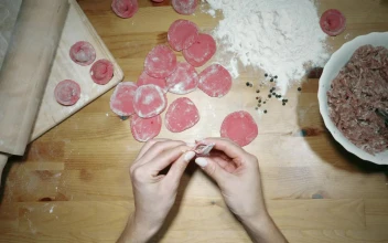 Stock Video Hands Making Red Dumplings On The Table Animated Wallpaper