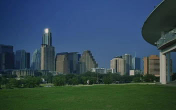 Stock Video Landscape Of A Meadow Surrounded By Trees And Buildings Animated Wallpaper