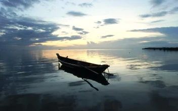 Stock Video Landscape Of A Boat On The Seashore At Sunset Animated Wallpaper