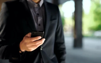 Stock Video Man In Suit Checks Time And Makes Phone Call Animated Wallpaper