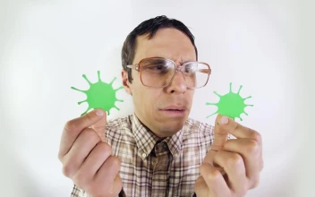 Stock Video Man In Glasses Looking At Forms Of Coronavirus Animated Wallpaper