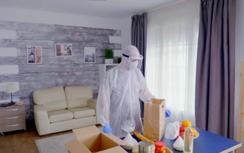 Stock Video Man In Coronavirus Safety Gear Packs Groceries Animated Wallpaper