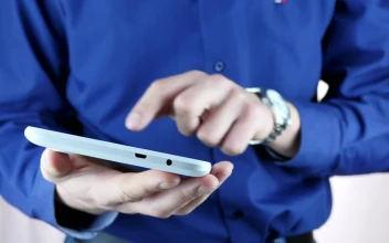 Stock Video Man In Blue Shirt Using A Tablet Animated Wallpaper