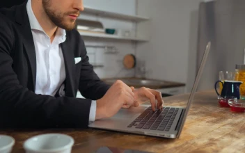Stock Video Man In A Suit Works From The Kitchen Animated Wallpaper