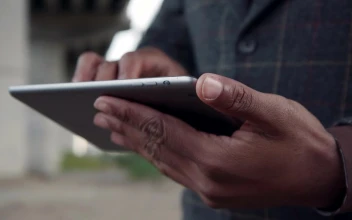Stock Video Man In A Suit Using A Tablet Animated Wallpaper