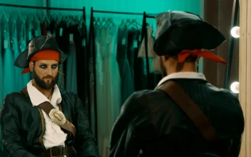 Stock Video Man In A Costume In Front Of A Mirror Animated Wallpaper