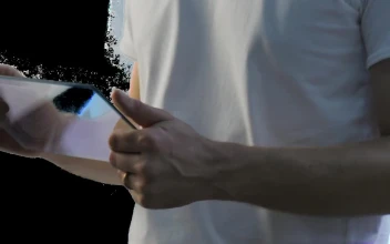 Stock Video Man Holding And Using A Futuristic Tablet Animated Wallpaper